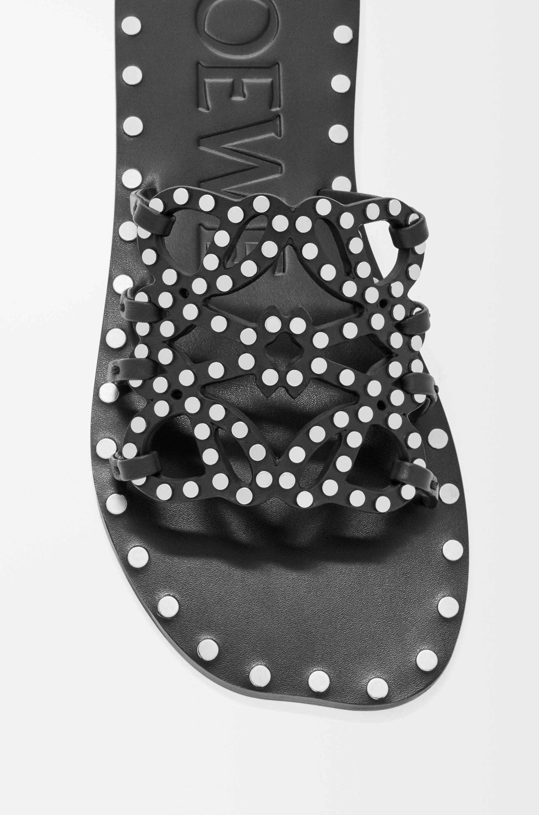 LOEWE Petal Anagram slide in vegetable-tanned calfskin and metallic studs Black