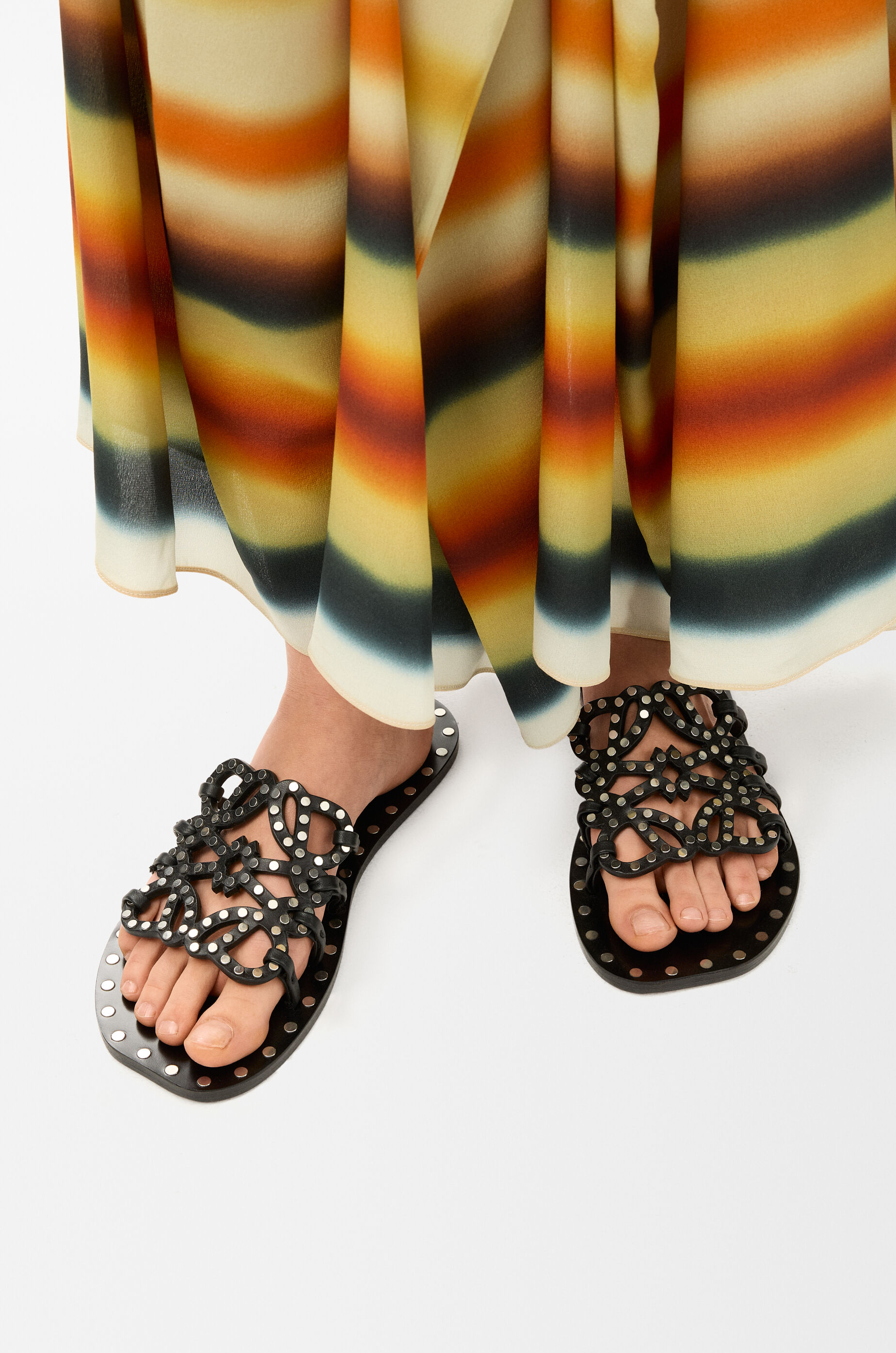 LOEWE Petal Anagram slide in vegetable-tanned calfskin and metallic studs Black