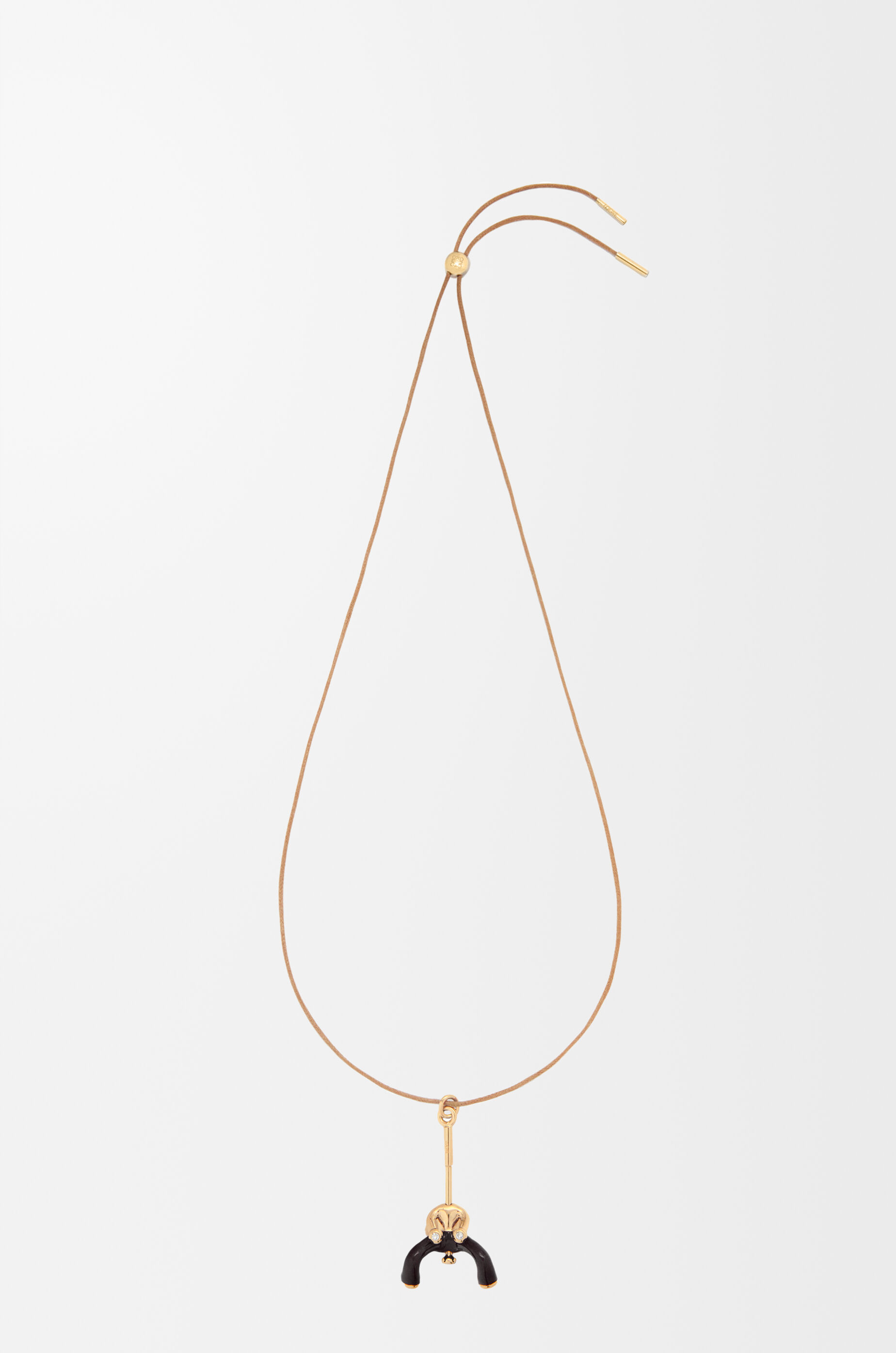 LOEWE Seated Acrobat pendant in sterling silver and crystals Gold/Black