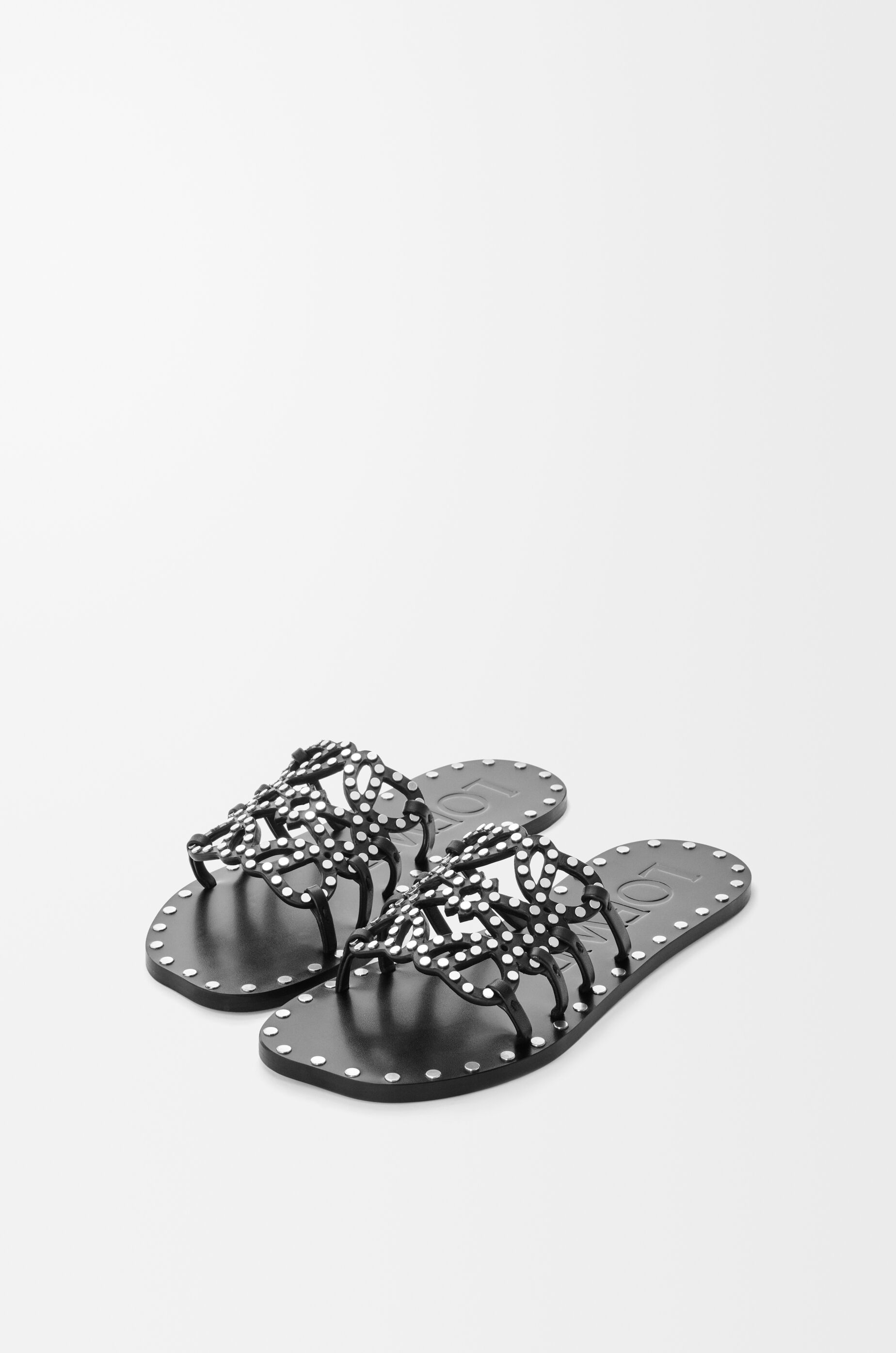 LOEWE Petal Anagram slide in vegetable-tanned calfskin and metallic studs Black