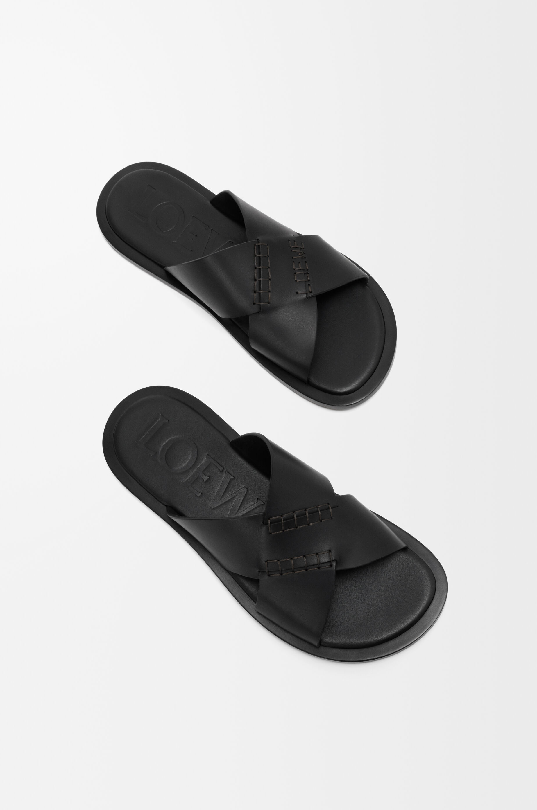 LOEWE Flex criss-cross slide in vegetable-tanned calfskin Black